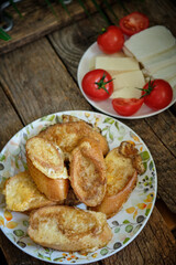 French toast with cheese. Top view, wooden background