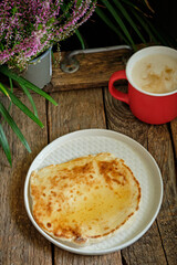 Honey flatbread. Wooden background, side view.