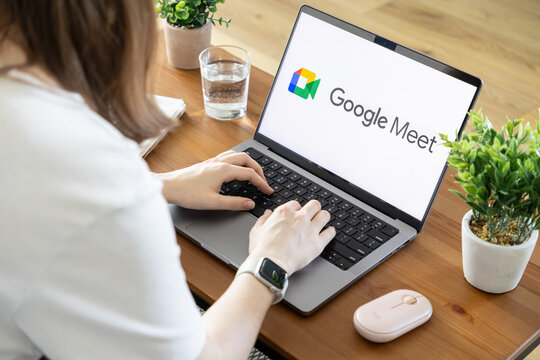Poznan, Poland - August 23, 2025: Google Meet application on laptop screen, person engaging in virtual meeting for remote work and effective online communication