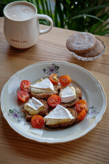 rye bread toasts with camembert and cherry tomatoes