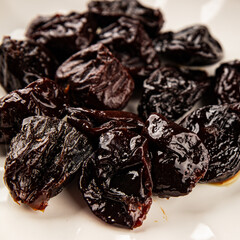Prunes smoked plum portion size natural product tasty snack fresh delicious gourmet food background on the table rustic top view copy space keto and paleo diet vegetarian and vegan food