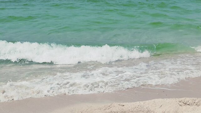 Water waves Sea Shore Beautiful Panorama white sand beach and turquoise water View. Holiday summer beach background, Wave of sea on White sandy beach. Timelapse Heavy Water Waves on Sandy Public Beach