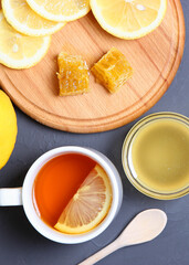 tea, honey and lemon on the table top view.. Vertical photo format