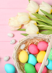 Easter eggs and flowers on the table top view. . Vertical photo format