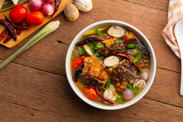 Sour and Spicy Smoked Catfish Soup,Grilled crispy catfish in Tom Klong soup.Top view.