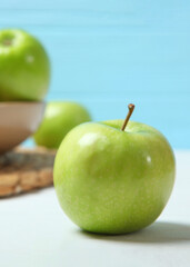 juicy green apples on a wooden table.. Vertical photo format
