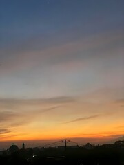 beautiful sunset in the city villages sky