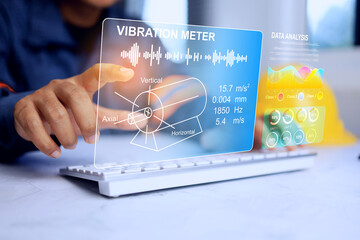 machine monitoring concept with engineer analyze motor vibration test result while working with...