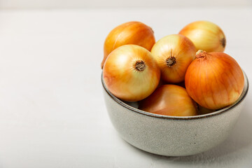 Onion on the kitchen table. onion slice. onion rings. Fresh Yellow Onion. Natural, fresh, vegetarian food. Agricultural products. Healthy eating. Vegetables. Farmer's market. Space for text.Copy space