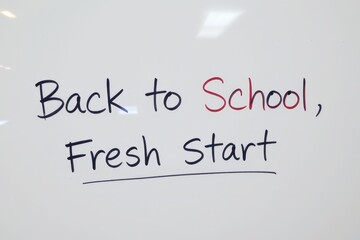 Fototapeta premium Back to School Fresh Start handwritten text on a white background education