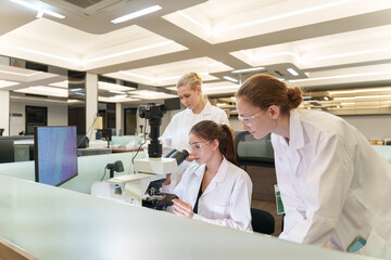 Scientists conduct research in a modern laboratory during a collaborative project