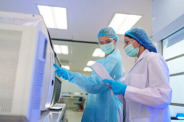 Laboratory technicians conduct experiments in a clean environment during the afternoon