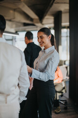 A diverse group of business associates engage in a collaborative brainstorming session in a modern...