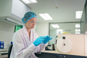 Scientist analyzing samples in laboratory setting during daytime