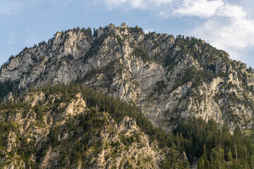 Scenic view of rugged mountain peaks under a clear sky in summer