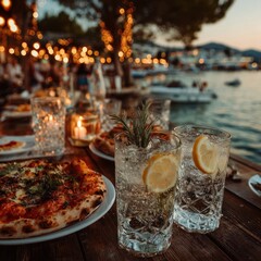 Outdoor dining by the sea at sunset
