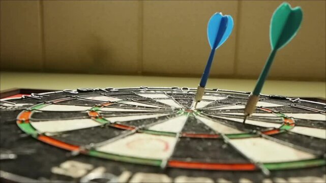 POV Shot of Throwing Darts at Dartboard in Game
