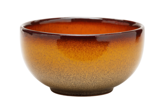 A bowl with a brown and orange glaze sits on a white background. The bowl is empty and has a simple, elegant design
