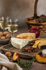 Blue cheese with berries and nuts on rustic background