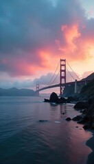 Obraz premium Misty morning on the San Francisco Bay, fog rolling in over calm waters, dramatic sky, Golden Gate Bridge in the distance , bay, still