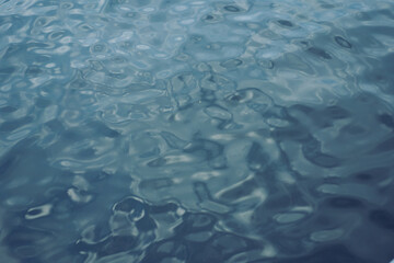 A boat is in the water with a blue sky