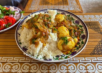 Indian egg curry served with steamed rice and salad
