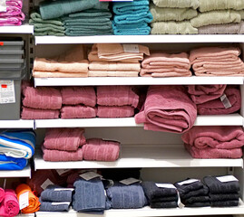 Stacked towels on a shelf - Colorful bathroom textiles -  A Display of Fresh Bathroom Textiles in...
