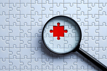 Magnifying Glass Focuses on Missing Jigsaw Puzzle Piece. AI Generated