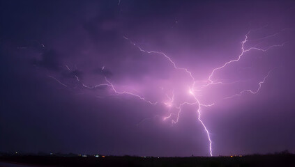 Dramatic lightning strikes illuminate a stormy sky, showcasing the powerful forces of nature in a captivating violet hue.