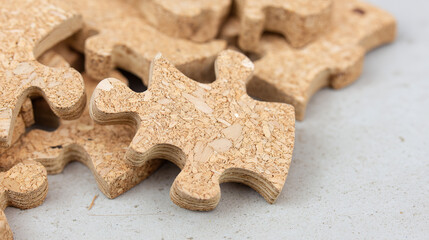 Close-Up of Wooden Puzzle Pieces with Natural Texture, Conveying an Eco-Friendly Concept and Minimal Rustic Style.