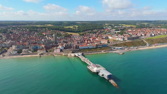 Aerial panning video of the Norfolk town of Cromer in the UK including the popular Victorian pier and church