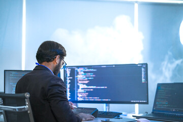A back-end developer working on complex code in a futuristic command center. A lone programmer...