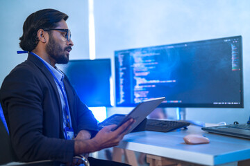 A back-end developer working on complex code in a futuristic command center. A lone programmer...
