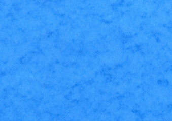 Blue blotched mottled texture blank paper background which is empty and blank with copy space, stationary stock photo image