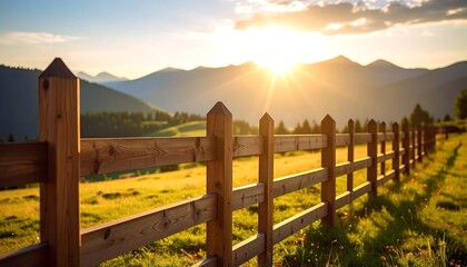 Sunrise over a rustic wooden fence in a meadow