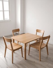 A simple, light-filled dining area features a light-colored wooden table and four matching chairs.