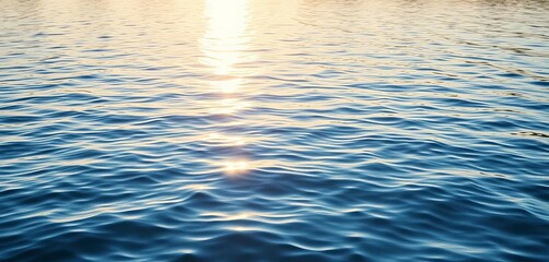 Sunlit ripples on a calm blue lake surface, gentle waves,  waves,  ocean
