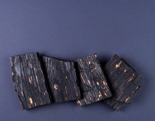 Charcoal wood planks on a dark background