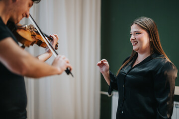 Music teacher instructing a violin student during a lesson in a classroom setting, fostering skills...