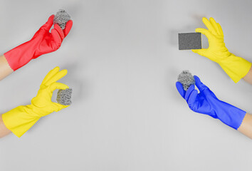 Cleaning Sponge in Yellow Rubber Glove on White 