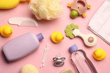 Baby bath accessories, care products and toys on pink background, flat lay