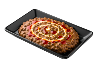 A rich, flavorful dish of spiced chickpeas, adorned with creamy sauce and vibrant red chutney, presented on a sleek black plate against a stark black background.