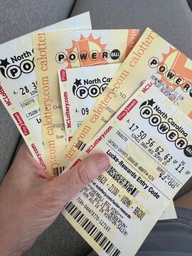 Close up of Powerball lottery tickets from North Carolina and California