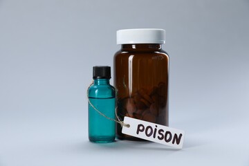 Bottles of poisons on light grey background