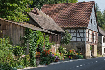 Old half-timbered house in Wiesentfels in Franconian Switzerland, right on the road