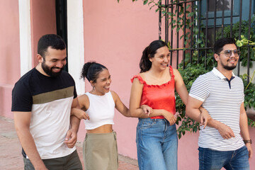 Happy tourists walking and laughing together in cartagena