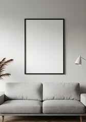 Chic Minimalist Living Room with a Large Blank Vertical Frame Mockup Above a Modern Grey Sofa.