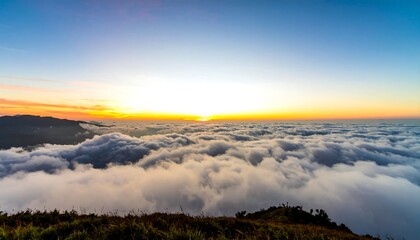 Obraz premium Sunrise over a sea of clouds (1)