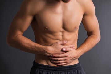 Fototapeta premium Robust Man Cradling Stomach in Distress: A Depiction of Digestive Struggles and Abdominal Pain