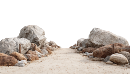 Path between large rocks on a sandy beach